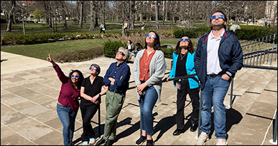 History staff gazes at the Spring 2024 solar eclipse