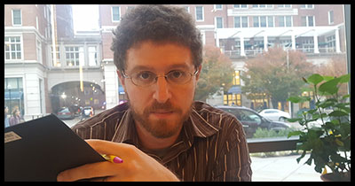 Jeff Eden makes a funny face at a cafe