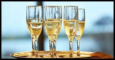 Champaign glasses on tray being served